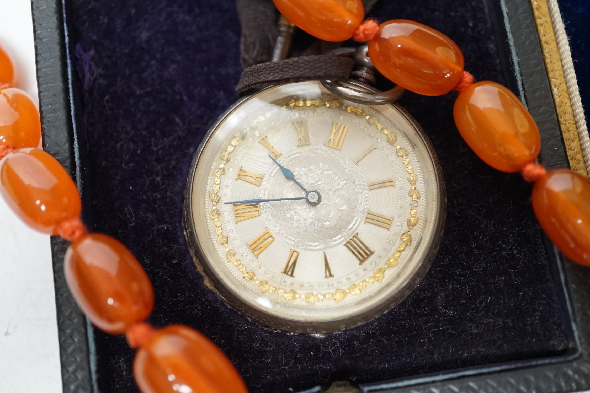 A Swiss 935 white metal fob watch, a gold played Waltham hunter pocket watch and a string of simulated amber beads. Condition - poor to fair